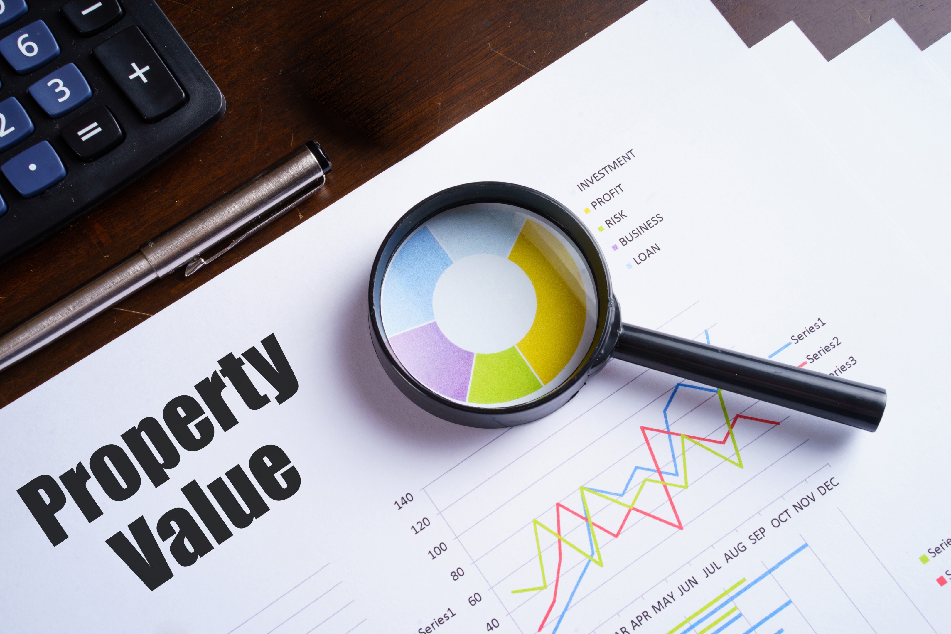 brown and white concrete house near green trees during daytime